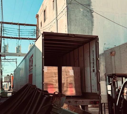 Truck with a loaded container on a city street