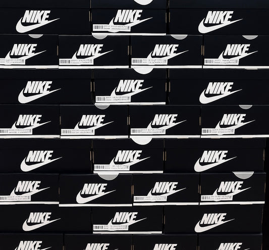 Stack of black Nike boxes with white logos